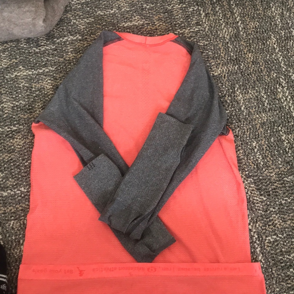 Pink and grey lululemon workout top size S/M